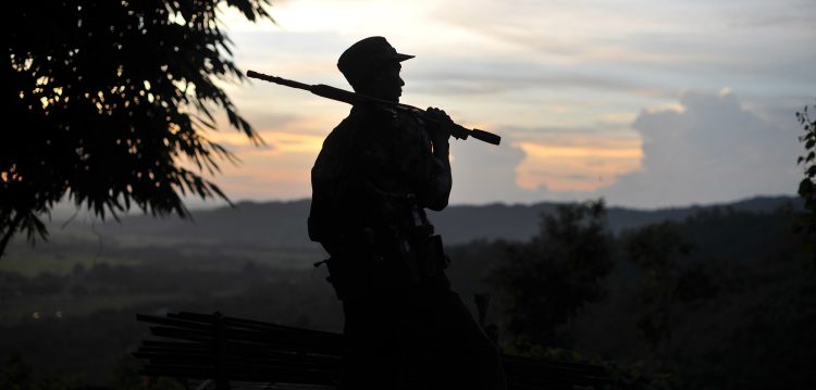 In the photo, a soldier from a resistance group allied with the Kachin Independence Army looks out from an outpost in northern Kachin state in September 2012.Photo credit: SOE THAN WIN/AFP/Getty Images